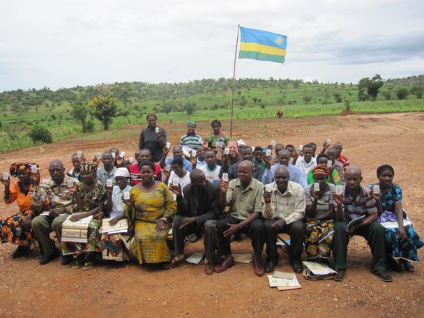 photo of villagers in Rwwanda demonstrating their clickers