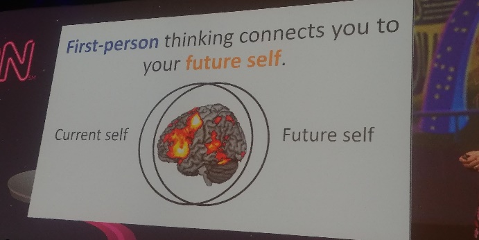 A sign reads: First-person thinking connects you to your future self.