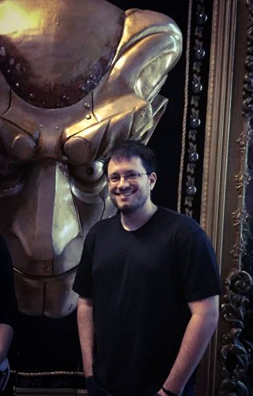 Author JD Dillon poses backstage with the Wizard’s mechanical head from the musical Wicked.