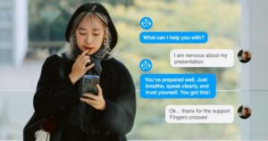 An olive-skinned woman dressed in black looks down at her phone. To the side we see her chat with an AI agent that it reassuring her that she will succeed in her upcoming presentation.