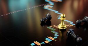 A shiny gold chess pawn stands amid 3 fallen black pawns on a screen showing colored the blocks of a box plot chart