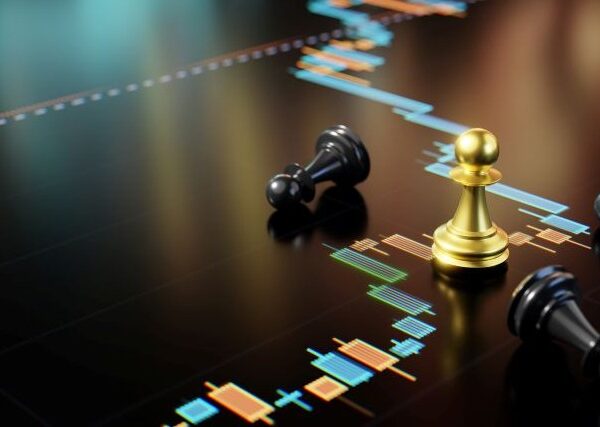 A shiny gold chess pawn stands amid 3 fallen black pawns on a screen showing colored the blocks of a box plot chart