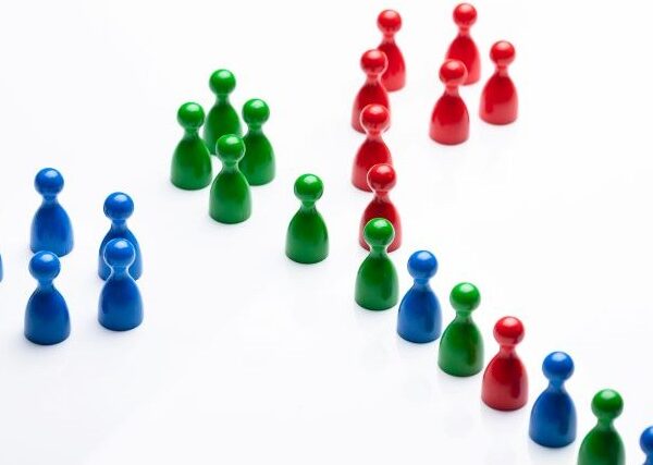 Clusters of red, green, and blue pegs join a line that mixes the colors together.