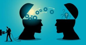 Silhouettes of 2 human heads face one another. One is lighted from within and has gears turning; the other is filled with question marks. A dark figure plugs one head into an electrical socket.