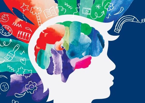 Against a dark blue background, the white shape of a human head looks to the right. Bands of bright color with icons representing thought and creativity emanate from the top and back of the head.