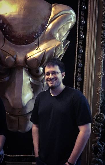 Author JD Dillon poses backstage with the Wizard’s mechanical head from the musical Wicked.