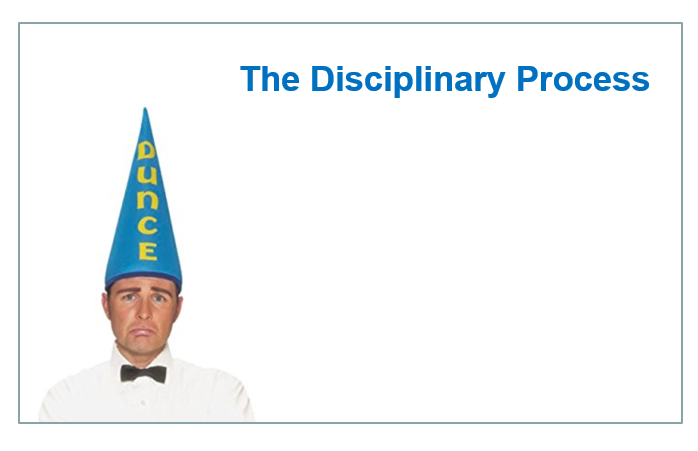 Worker wearing a dunce cap.