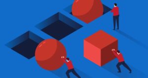 Cartoon men wearing red jackets attempt to push two round and one square shapes into square holes on a large blue surface